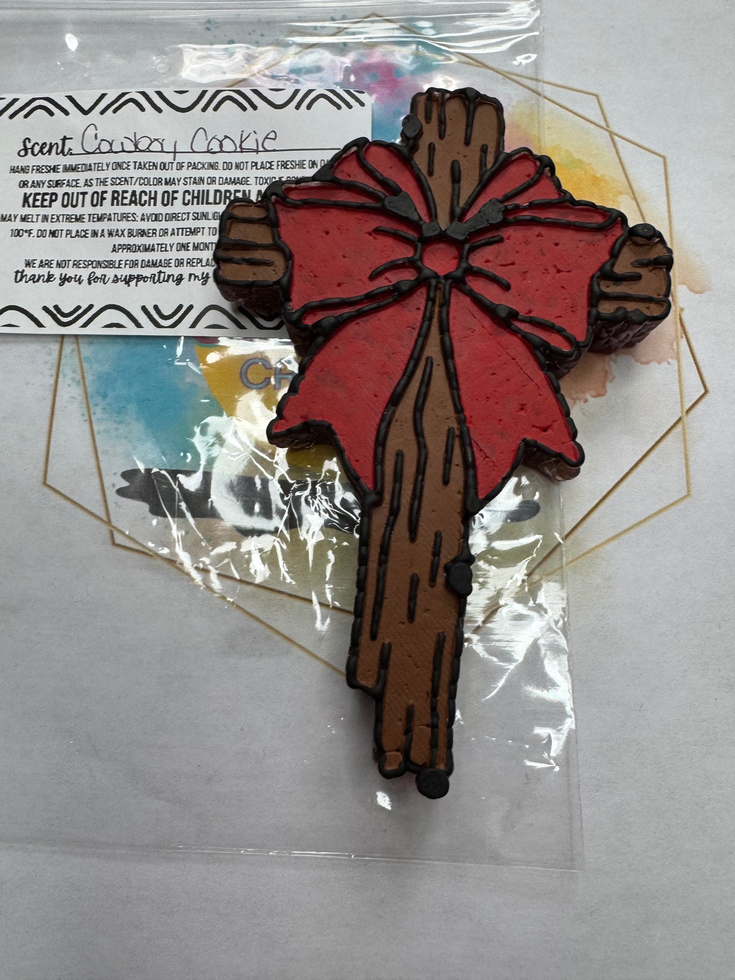 Cross w/ Red bow.... Cowboy Cookie scented || Car Freshie